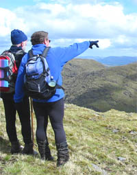 Two hillwalkers on a mountain trail